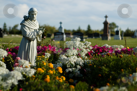 To use this stock image in your creative project, please select the size you need over to the right and click the "Add to Cart" button.
Your downloaded image will come with the Cutcaster watermark removed so don’t worry about the watermark you see on this page. Holy Land stock photo, A spiritual cemetery with a stone statue surrounded by flowers by Richard Nelson