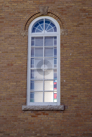 To use this stock image in your creative project, please select the size you need over to the right and click the "Add to Cart" button.
Your downloaded image will come with the Cutcaster watermark removed so don’t worry about the watermark you see on this page. Church Window stock photo, A small church window built into some bricks by Richard Nelson