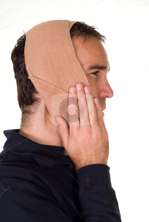 To use this stock image in your creative project, please select the size you need over to the right and click the "Add to Cart" button.
Your downloaded image will come with the Cutcaster watermark removed so don’t worry about the watermark you see on this page. Toothache stock photo, Profile view of a man weaing a bandage for his tooth pain by Richard Nelson