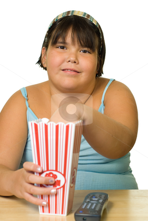 To use this stock image in your creative project, please select the size you need over to the right and click the "Add to Cart" button.
Your downloaded image will come with the Cutcaster watermark removed so don’t worry about the watermark you see on this page. Girl Watching Movie stock photo, A young girl watching a movie and eating popcorn by Richard Nelson