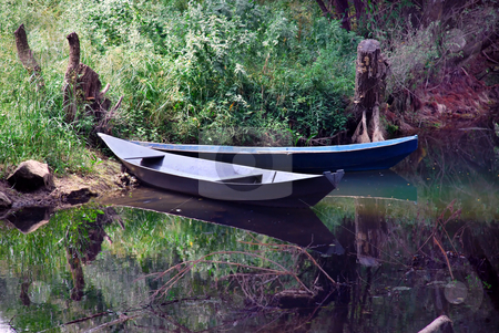 To use this stock image in your creative project, please select the size you need over to the right and click the "Add to Cart" button.
Your downloaded image will come with the Cutcaster watermark removed so don’t worry about the watermark you see on this page. Boats over tranquil water stock photo, Two small boats over tranquil river landscape by Julija Sapic