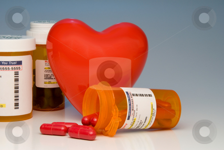 To use this stock image in your creative project, please select the size you need over to the right and click the "Add to Cart" button.
Your downloaded image will come with the Cutcaster watermark removed so don’t worry about the watermark you see on this page. Prescription Medication stock photo, A heart and bottles of prescription medication. by Robert Byron