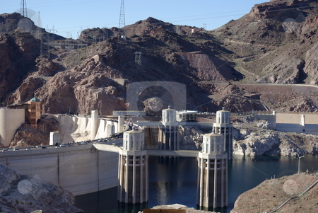 To use this stock image in your creative project, please select the size you need over to the right and click the "Add to Cart" button.
Your downloaded image will come with the Cutcaster watermark removed so don’t worry about the watermark you see on this page. Lake Mead Side of Hoover Dam stock photo, Built on the Colorado River and the border of Arizona and Nevada, the Hoover Dam is a prime example of a man-made wonder. This view from the east side, above the dam, shows some of the electrical generating structures. It took four years to build the Hoover Dam between 1931-1935. by Dennis Thomsen