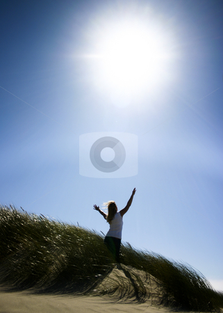 To use this stock image in your creative project, please select the size you need over to the right and click the "Add to Cart" button.
Your downloaded image will come with the Cutcaster watermark removed so don’t worry about the watermark you see on this page. Woman Praise the Lord stock photo, Woman standing in tall grass on beach with arms raised to the sun. by Nikki Rose