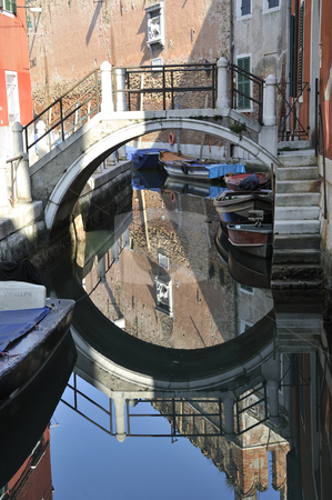 To use this stock image in your creative project, please select the size you need over to the right and click the "Add to Cart" button.
Your downloaded image will come with the Cutcaster watermark removed so don’t worry about the watermark you see on this page. Bridge stock photo, Bridge over canal in Venice, Italy by Csaba Zsarnowszky