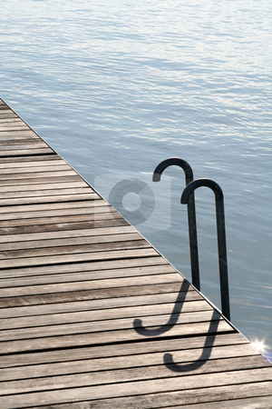 To use this stock image in your creative project, please select the size you need over to the right and click the "Add to Cart" button.
Your downloaded image will come with the Cutcaster watermark removed so don’t worry about the watermark you see on this page. Waterside walkway stock photo, Wooden waterside walkway with ladder into the water by Kheng Guan Toh