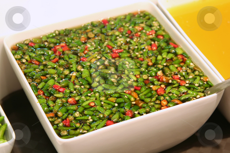 To use this stock image in your creative project, please select the size you need over to the right and click the "Add to Cart" button.
Your downloaded image will come with the Cutcaster watermark removed so don’t worry about the watermark you see on this page. Chopped chillis stock photo, Chopped chillis in soya sauche traditional asian cuisine by Kheng Guan Toh