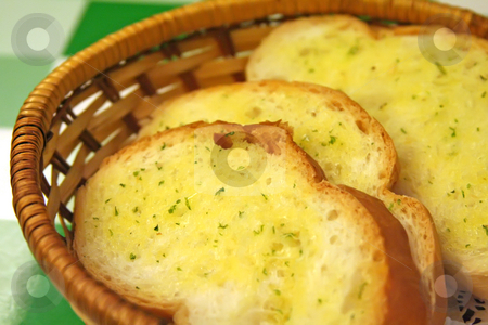 To use this stock image in your creative project, please select the size you need over to the right and click the "Add to Cart" button.
Your downloaded image will come with the Cutcaster watermark removed so don’t worry about the watermark you see on this page. Garlic bread stock photo, Garlic bread in a basket in restaurant setting by Kheng Guan Toh