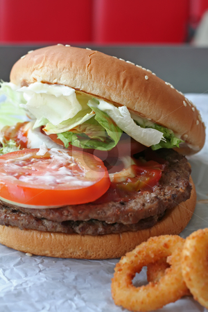 To use this stock image in your creative project, please select the size you need over to the right and click the "Add to Cart" button.
Your downloaded image will come with the Cutcaster watermark removed so don’t worry about the watermark you see on this page. Fastfood hamburger stock photo, Fastfood hamburger bun on paper wrapper by Kheng Guan Toh