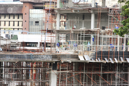 To use this stock image in your creative project, please select the size you need over to the right and click the "Add to Cart" button.
Your downloaded image will come with the Cutcaster watermark removed so don’t worry about the watermark you see on this page. Construction site stock photo, Urban construction site with workmen in downtown manila by Kheng Guan Toh