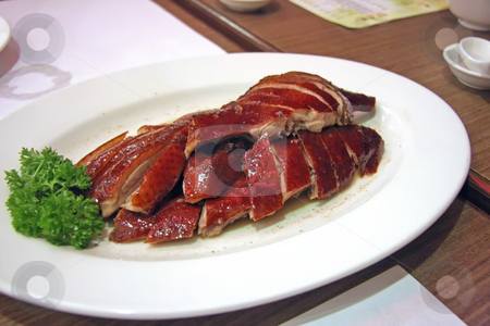To use this stock image in your creative project, please select the size you need over to the right and click the "Add to Cart" button.
Your downloaded image will come with the Cutcaster watermark removed so don’t worry about the watermark you see on this page. Roast duck stock photo, Roast duck chinese cuisine sliced portions on plate by Kheng Guan Toh