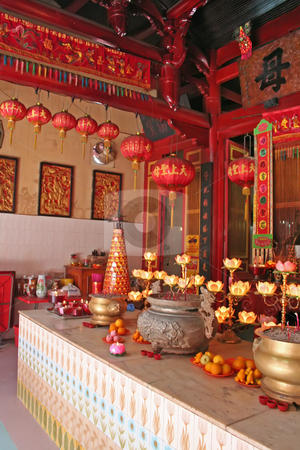 To use this stock image in your creative project, please select the size you need over to the right and click the "Add to Cart" button.
Your downloaded image will come with the Cutcaster watermark removed so don’t worry about the watermark you see on this page. Chinese altar stock photo, Altar in a chinese temple with various offerings and candles by Kheng Guan Toh