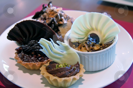 To use this stock image in your creative project, please select the size you need over to the right and click the "Add to Cart" button.
Your downloaded image will come with the Cutcaster watermark removed so don’t worry about the watermark you see on this page. Chocolate dessert stock photo, Chocolate pudding pastry cups and other desserts by Kheng Guan Toh