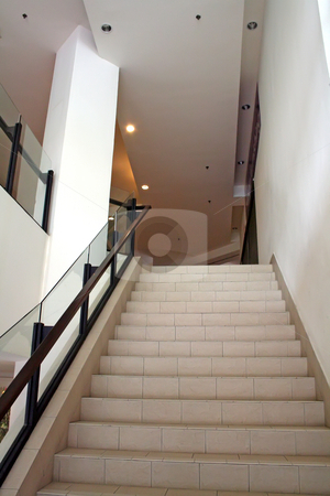 To use this stock image in your creative project, please select the size you need over to the right and click the "Add to Cart" button.
Your downloaded image will come with the Cutcaster watermark removed so don’t worry about the watermark you see on this page. Modern staircase stock photo, Modern glass and steel staircase bright airy by Kheng Guan Toh