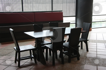To use this stock image in your creative project, please select the size you need over to the right and click the "Add to Cart" button.
Your downloaded image will come with the Cutcaster watermark removed so don’t worry about the watermark you see on this page. Restaurant furniture stock photo, Wooden restaurant table and chairs high contrast by Kheng Guan Toh