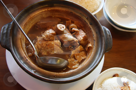 To use this stock image in your creative project, please select the size you need over to the right and click the "Add to Cart" button.
Your downloaded image will come with the Cutcaster watermark removed so don’t worry about the watermark you see on this page. Chinese soup stock photo, Chinese traditional herbal claypot soup hot with ladel by Kheng Guan Toh