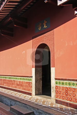 To use this stock image in your creative project, please select the size you need over to the right and click the "Add to Cart" button.
Your downloaded image will come with the Cutcaster watermark removed so don’t worry about the watermark you see on this page. Chinese entrance stock photo, Entrance to chinese building traditional style old fashioned red wall by Kheng Guan Toh