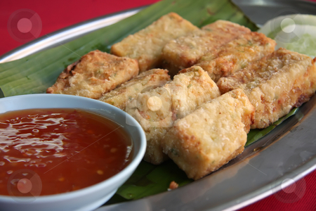 To use this stock image in your creative project, please select the size you need over to the right and click the "Add to Cart" button.
Your downloaded image will come with the Cutcaster watermark removed so don’t worry about the watermark you see on this page. Fried tofu stock photo, Fried tofu beancurd with dipping sauce traditional chinese cuisine by Kheng Guan Toh