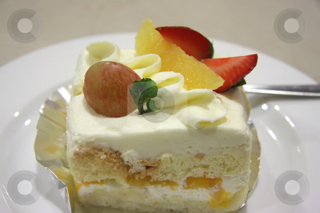 To use this stock image in your creative project, please select the size you need over to the right and click the "Add to Cart" button.
Your downloaded image will come with the Cutcaster watermark removed so don’t worry about the watermark you see on this page. Cream cake stock photo, Cream chiffon cake with fruits and icing by Kheng Guan Toh