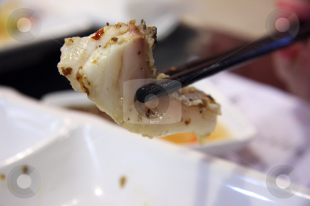 To use this stock image in your creative project, please select the size you need over to the right and click the "Add to Cart" button.
Your downloaded image will come with the Cutcaster watermark removed so don’t worry about the watermark you see on this page. Fish in chopsticks stock photo, Cooked fish held in chopsticks chinese cuisine by Kheng Guan Toh
