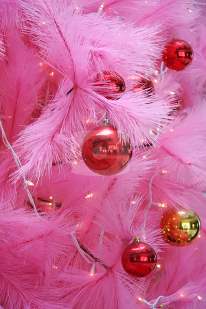 To use this stock image in your creative project, please select the size you need over to the right and click the "Add to Cart" button.
Your downloaded image will come with the Cutcaster watermark removed so don’t worry about the watermark you see on this page. Pink christmas stock photo, Closeup of a pink chirstmas tree with ornaments by Kheng Guan Toh