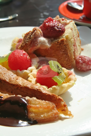 To use this stock image in your creative project, please select the size you need over to the right and click the "Add to Cart" button.
Your downloaded image will come with the Cutcaster watermark removed so don’t worry about the watermark you see on this page. Dessert pastries stock photo, Dessert fruit cups and pastries on white plate by Kheng Guan Toh