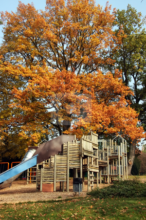 To use this stock image in your creative project, please select the size you need over to the right and click the "Add to Cart" button.
Your downloaded image will come with the Cutcaster watermark removed so don’t worry about the watermark you see on this page. Autumn playground stock photo, Children's playground wooden playset autumn trees background by Kheng Guan Toh