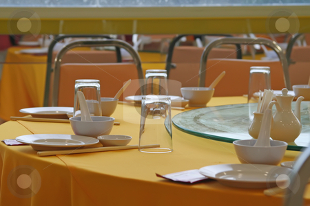 To use this stock image in your creative project, please select the size you need over to the right and click the "Add to Cart" button.
Your downloaded image will come with the Cutcaster watermark removed so don’t worry about the watermark you see on this page. Chinese restauarant stock photo, Table and place setting contemporary chinese restaurant by Kheng Guan Toh