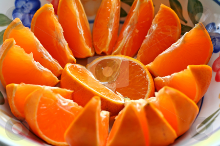 To use this stock image in your creative project, please select the size you need over to the right and click the "Add to Cart" button.
Your downloaded image will come with the Cutcaster watermark removed so don’t worry about the watermark you see on this page. Sliced oranges stock photo, Sliced oranges arranged spread on a plate by Kheng Guan Toh