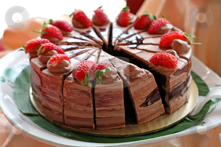 To use this stock image in your creative project, please select the size you need over to the right and click the "Add to Cart" button.
Your downloaded image will come with the Cutcaster watermark removed so don’t worry about the watermark you see on this page. Chocolate cake stock photo, Chocolate cake with icing and strawberries sliced by Kheng Guan Toh
