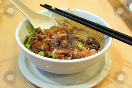To use this stock image in your creative project, please select the size you need over to the right and click the "Add to Cart" button.
Your downloaded image will come with the Cutcaster watermark removed so don’t worry about the watermark you see on this page. Vietnamese noodles stock photo, Traditional vietnamese dish of noodles and beef soup by Kheng Guan Toh