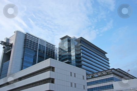 To use this stock image in your creative project, please select the size you need over to the right and click the "Add to Cart" button.
Your downloaded image will come with the Cutcaster watermark removed so don’t worry about the watermark you see on this page. Corporate building stock photo, Modern corporate office city building in Singapore by Kheng Guan Toh