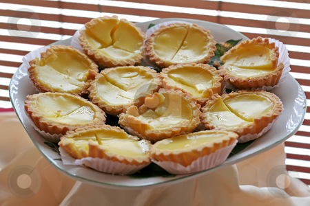 To use this stock image in your creative project, please select the size you need over to the right and click the "Add to Cart" button.
Your downloaded image will come with the Cutcaster watermark removed so don’t worry about the watermark you see on this page. Asian egg tarts stock photo, Traditional asian dessert egg tarts sweet custard pie by Kheng Guan Toh