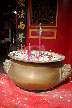 To use this stock image in your creative project, please select the size you need over to the right and click the "Add to Cart" button.
Your downloaded image will come with the Cutcaster watermark removed so don’t worry about the watermark you see on this page. Chinese temple stock photo, Traditional chinese temple red design with brass incense holder by Kheng Guan Toh