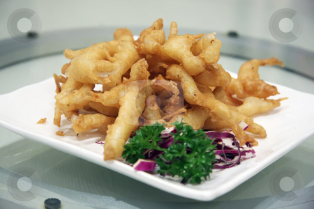 To use this stock image in your creative project, please select the size you need over to the right and click the "Add to Cart" button.
Your downloaded image will come with the Cutcaster watermark removed so don’t worry about the watermark you see on this page. Fish nuggets stock photo, Batter fried golden fish nuggets in plate by Kheng Guan Toh