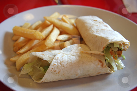 To use this stock image in your creative project, please select the size you need over to the right and click the "Add to Cart" button.
Your downloaded image will come with the Cutcaster watermark removed so don’t worry about the watermark you see on this page. Mexican burritos stock photo, Burritos mexican cuisine wraps with french fries by Kheng Guan Toh