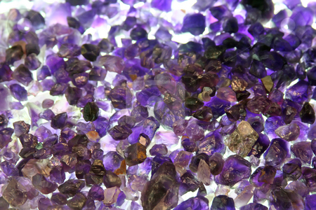 To use this stock image in your creative project, please select the size you need over to the right and click the "Add to Cart" button.
Your downloaded image will come with the Cutcaster watermark removed so don’t worry about the watermark you see on this page. Raw amethyst gemstones stock photo, Amethyst crystals rough and uncut raw gemstones by Kheng Guan Toh