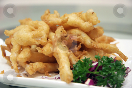 To use this stock image in your creative project, please select the size you need over to the right and click the "Add to Cart" button.
Your downloaded image will come with the Cutcaster watermark removed so don’t worry about the watermark you see on this page. Fish nuggets stock photo, Batter fried golden fish nuggets in plate by Kheng Guan Toh