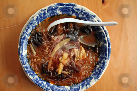 To use this stock image in your creative project, please select the size you need over to the right and click the "Add to Cart" button.
Your downloaded image will come with the Cutcaster watermark removed so don’t worry about the watermark you see on this page. Asian soup noodles stock photo, Dish of spicy soup and noodles traditional asian cuisine by Kheng Guan Toh