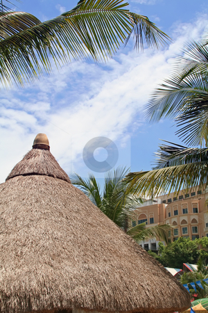 To use this stock image in your creative project, please select the size you need over to the right and click the "Add to Cart" button.
Your downloaded image will come with the Cutcaster watermark removed so don’t worry about the watermark you see on this page. Tropical hut stock photo, Thatched hut of a roof in a tropical resort by Kheng Guan Toh