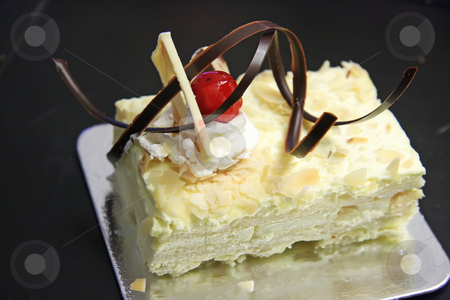 To use this stock image in your creative project, please select the size you need over to the right and click the "Add to Cart" button.
Your downloaded image will come with the Cutcaster watermark removed so don’t worry about the watermark you see on this page. Sponge cake stock photo, Sansrival white sponge cake with icing rectangle cut by Kheng Guan Toh