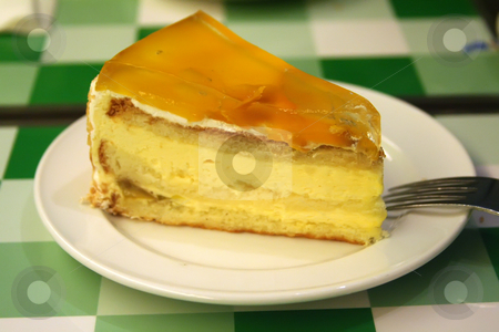 To use this stock image in your creative project, please select the size you need over to the right and click the "Add to Cart" button.
Your downloaded image will come with the Cutcaster watermark removed so don’t worry about the watermark you see on this page. Mango cream cake stock photo, Mango cream cake on white plate restaurant setting by Kheng Guan Toh