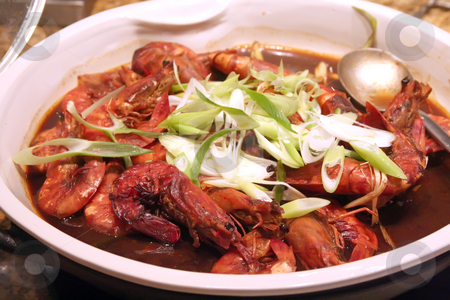 To use this stock image in your creative project, please select the size you need over to the right and click the "Add to Cart" button.
Your downloaded image will come with the Cutcaster watermark removed so don’t worry about the watermark you see on this page. Prawn dish stock photo, Cooked prawn dish with gravy restaurant setting by Kheng Guan Toh
