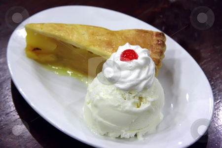 To use this stock image in your creative project, please select the size you need over to the right and click the "Add to Cart" button.
Your downloaded image will come with the Cutcaster watermark removed so don’t worry about the watermark you see on this page. Apple pie with ice cream stock photo, Apple pie ala mode with vanilla ice cream by Kheng Guan Toh