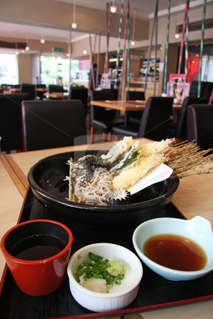 To use this stock image in your creative project, please select the size you need over to the right and click the "Add to Cart" button.
Your downloaded image will come with the Cutcaster watermark removed so don’t worry about the watermark you see on this page. Udon and tempura stock photo, Japanese cuisine udon and tempura fried prawns combo by Kheng Guan Toh