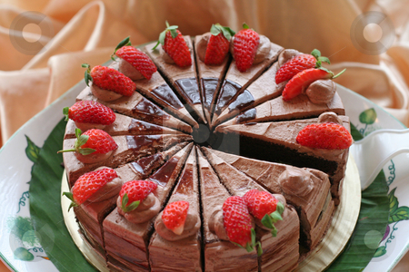 To use this stock image in your creative project, please select the size you need over to the right and click the "Add to Cart" button.
Your downloaded image will come with the Cutcaster watermark removed so don’t worry about the watermark you see on this page. Chocolate cake stock photo, Chocolate cake with icing and strawberries sliced by Kheng Guan Toh