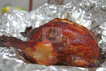 To use this stock image in your creative project, please select the size you need over to the right and click the "Add to Cart" button.
Your downloaded image will come with the Cutcaster watermark removed so don’t worry about the watermark you see on this page. Whole roast chicken stock photo, Whole roast chicken wth rice stuffing in aluminum foil by Kheng Guan Toh