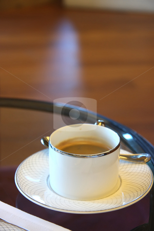 To use this stock image in your creative project, please select the size you need over to the right and click the "Add to Cart" button.
Your downloaded image will come with the Cutcaster watermark removed so don’t worry about the watermark you see on this page. Cup of coffee stock photo, Cup of coffee in porcelein cup elegant setting by Kheng Guan Toh