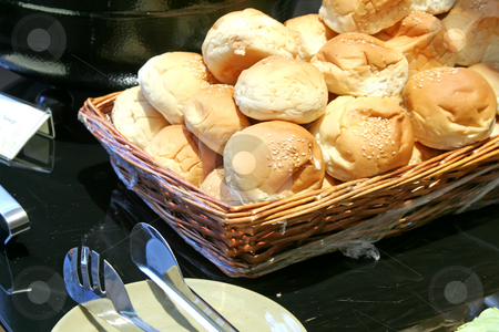 To use this stock image in your creative project, please select the size you need over to the right and click the "Add to Cart" button.
Your downloaded image will come with the Cutcaster watermark removed so don’t worry about the watermark you see on this page. Dinner rolls stock photo, Dinner rolls in a basket in restaurant buffet by Kheng Guan Toh