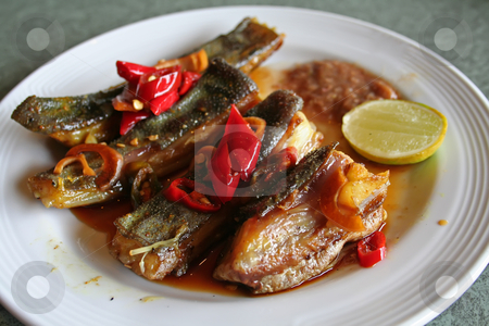 To use this stock image in your creative project, please select the size you need over to the right and click the "Add to Cart" button.
Your downloaded image will come with the Cutcaster watermark removed so don’t worry about the watermark you see on this page. Grilled fish stock photo, Spicy grilled rayfish traditional asian cuisine on white plate by Kheng Guan Toh